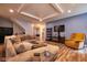 Comfortable living room with a cozy sectional couch, wood floors, and recessed lighting at 9705 Valley Springs Blvd, Fishers, IN 46037