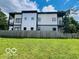 Modern home with a spacious yard and fenced perimeter at 1001 Harlan St, Indianapolis, IN 46203