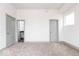 Clean bedroom with soft carpet, white walls, and streamlined doors for a modern look at 1001 Harlan St, Indianapolis, IN 46203