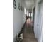 Long, bright hallway with hardwood floors and modern wall decor at 1001 Harlan St, Indianapolis, IN 46203
