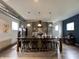 Modern kitchen featuring gray cabinets, an island with seating, and stainless steel appliances at 1001 Harlan St, Indianapolis, IN 46203