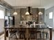 Bright kitchen showcasing a large island, gray cabinetry, stainless steel refrigerator, and pendant lighting at 1001 Harlan St, Indianapolis, IN 46203
