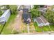 Expansive aerial view of a beautifully landscaped property, complemented by a meticulously maintained lawn at 1027 Hosbrook St, Indianapolis, IN 46203