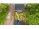 High angle aerial view of a home featuring a well manicured lawn and concrete pathway at 1027 Hosbrook St, Indianapolis, IN 46203