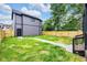 Well-maintained backyard with a concrete pathway and privacy fence, perfect for outdoor enjoyment at 1027 Hosbrook St, Indianapolis, IN 46203