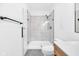 Contemporary bathroom with glass shower enclosure, stone tile, and modern fixtures at 1027 Hosbrook St, Indianapolis, IN 46203