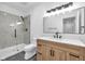 Nicely remodeled bathroom with glass shower and modern vanity, mirror, and light fixture at 1027 Hosbrook St, Indianapolis, IN 46203