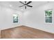 Bright and open bedroom with hardwood floors and two windows at 1027 Hosbrook St, Indianapolis, IN 46203