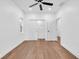Bedroom featuring hardwood floors, a ceiling fan, and a closet at 1027 Hosbrook St, Indianapolis, IN 46203