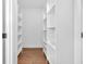 Spacious walk-in closet with built-in shelving and ample storage space at 1027 Hosbrook St, Indianapolis, IN 46203