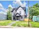Charming two-story home with a beautifully landscaped yard and inviting exterior, perfect for modern living at 1027 Hosbrook St, Indianapolis, IN 46203