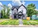 Charming two-story home with a beautifully landscaped yard and inviting exterior, perfect for modern living at 1027 Hosbrook St, Indianapolis, IN 46203