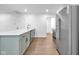 Modern kitchen features stainless steel appliances, light blue cabinetry, and a quartz countertop at 1027 Hosbrook St, Indianapolis, IN 46203