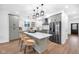 Bright kitchen featuring stainless steel appliances, an island with seating, and modern white and grey cabinets at 1027 Hosbrook St, Indianapolis, IN 46203