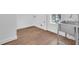 Efficient laundry room featuring hardwood floors, window and stainless steel sink at 1027 Hosbrook St, Indianapolis, IN 46203