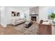 Inviting living room with a modern fireplace, comfortable sofa, accent chairs, and a large rug at 1027 Hosbrook St, Indianapolis, IN 46203
