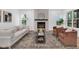Bright living room featuring a decorative fireplace, plush seating, and stylish rug, creating a comfortable and inviting atmosphere at 1027 Hosbrook St, Indianapolis, IN 46203