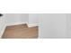 Image shows a minimal corner with wood-look floors and white walls at 1027 Hosbrook St, Indianapolis, IN 46203