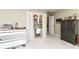 This spare bedroom includes a built-in closet workstation and a black storage cabinet at 10759 Sawgrass Dr, Fishers, IN 46037