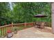 Outdoor deck with ample seating, perfect for enjoying the lush greenery and outdoor gatherings at 10759 Sawgrass Dr, Fishers, IN 46037