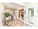 Welcoming entryway with tile flooring and an open floorplan leading to the kitchen and dining area at 10759 Sawgrass Dr, Fishers, IN 46037