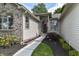 Inviting front entrance with manicured landscaping, a stone walkway, and an American flag display at 10759 Sawgrass Dr, Fishers, IN 46037