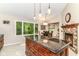 Gourmet kitchen featuring a center island, modern appliances, and a breakfast nook at 10759 Sawgrass Dr, Fishers, IN 46037