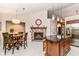 Spacious kitchen with granite countertops, a brick fireplace, and ample cabinet space at 10759 Sawgrass Dr, Fishers, IN 46037
