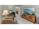 This living room features a large flat screen television, comfortable seating, and natural light at 10759 Sawgrass Dr, Fishers, IN 46037