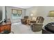 Comfortable living room with two recliners, a small side table and large flat screen television at 10759 Sawgrass Dr, Fishers, IN 46037