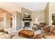 Inviting living room features a cozy fireplace and comfortable seating at 10759 Sawgrass Dr, Fishers, IN 46037