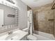 Bathroom featuring granite tile shower, stylish vanity and shower curtain at 11072 Lake Run Dr, Fishers, IN 46038