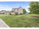 Charming two-story home with a well-maintained lawn, and tasteful landscaping at 11072 Lake Run Dr, Fishers, IN 46038