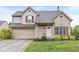 Charming two-story home with a combination of vinyl siding and brick, red shutters, and a well-maintained front yard at 11072 Lake Run Dr, Fishers, IN 46038