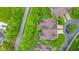 Overhead view of a home with manicured lawn, complemented by tree-lined streets in a quiet and upscale neighborhood at 11510 Monon Farms Ln, Carmel, IN 46032