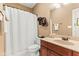 Well-maintained bathroom featuring a single sink vanity and shower/tub combo at 11510 Monon Farms Ln, Carmel, IN 46032