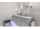 Bathroom with double sinks, granite countertops, custom cabinetry and modern lighting at 11510 Monon Farms Ln, Carmel, IN 46032