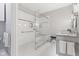 Modern bathroom featuring a glass-enclosed shower with white subway tile, built-in shelves, and marble counters at 11510 Monon Farms Ln, Carmel, IN 46032