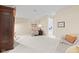 Spacious bedroom with neutral carpet, stylish decor, and a view into the office space at 11510 Monon Farms Ln, Carmel, IN 46032