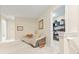 Sitting area with cozy sofa, decorative art and a glimpse into storage space at 11510 Monon Farms Ln, Carmel, IN 46032