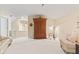 Large bedroom with vaulted ceilings, hardwood wardrobe and comfortable sitting area at 11510 Monon Farms Ln, Carmel, IN 46032