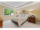 Cozy bedroom with a tray ceiling, and windows allowing natural light at 11510 Monon Farms Ln, Carmel, IN 46032