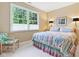 Charming bedroom features large windows offering natural light and a comfortable sitting area at 11510 Monon Farms Ln, Carmel, IN 46032