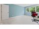A brightly lit bedroom with soft carpeting and a large window for natural light at 11510 Monon Farms Ln, Carmel, IN 46032