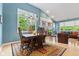 Elegant dining room with large windows, a chandelier, and a view of the living room at 11510 Monon Farms Ln, Carmel, IN 46032