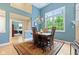 Dining room with hardwood floors and view to office room at 11510 Monon Farms Ln, Carmel, IN 46032