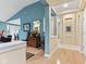 Bright foyer featuring hardwood floors, neutral paint, and transitional decor at 11510 Monon Farms Ln, Carmel, IN 46032