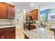 Kitchen featuring granite countertops, stainless steel appliances, and wood cabinetry at 11510 Monon Farms Ln, Carmel, IN 46032