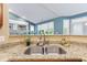 Kitchen with granite countertops, stainless steel sink, and wood cabinets at 11510 Monon Farms Ln, Carmel, IN 46032