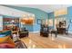 Spacious living room with an open floor plan flowing into the dining area and featuring hardwood floors at 11510 Monon Farms Ln, Carmel, IN 46032